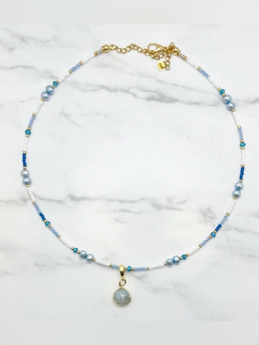 Freshwater Pearl Necklace with blue & white seed beads and gold, stone charm